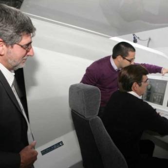 The President driving Lander's simulator